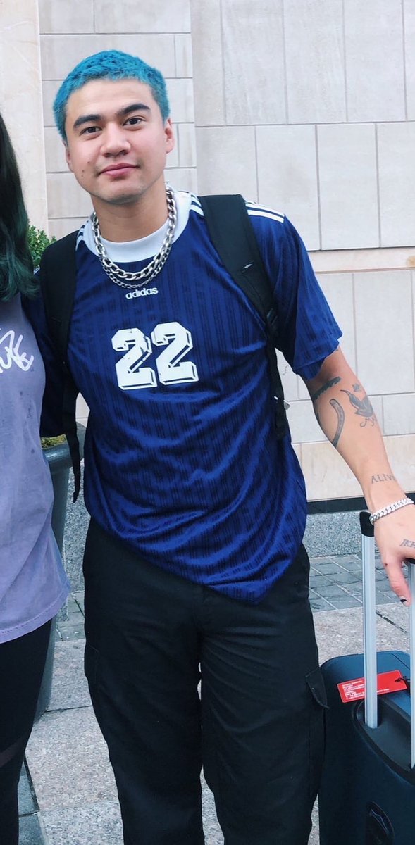 calum hood wearing colourful clothes; a thread