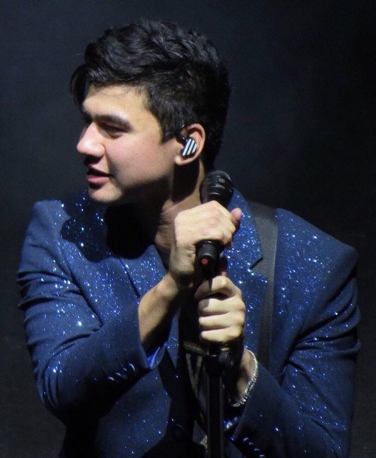 calum hood wearing colourful clothes; a thread