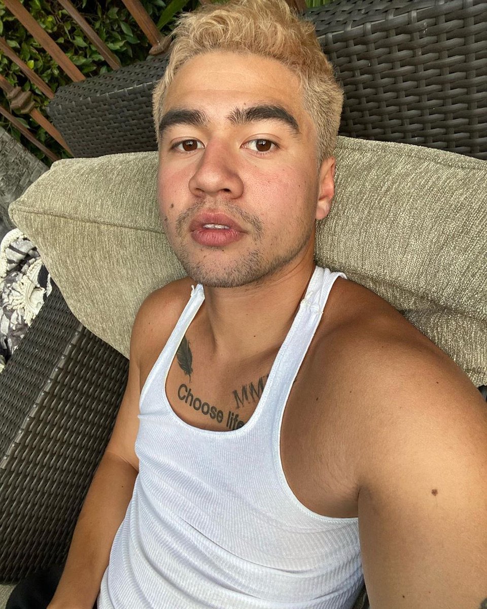 calum hood wearing colourful clothes; a thread