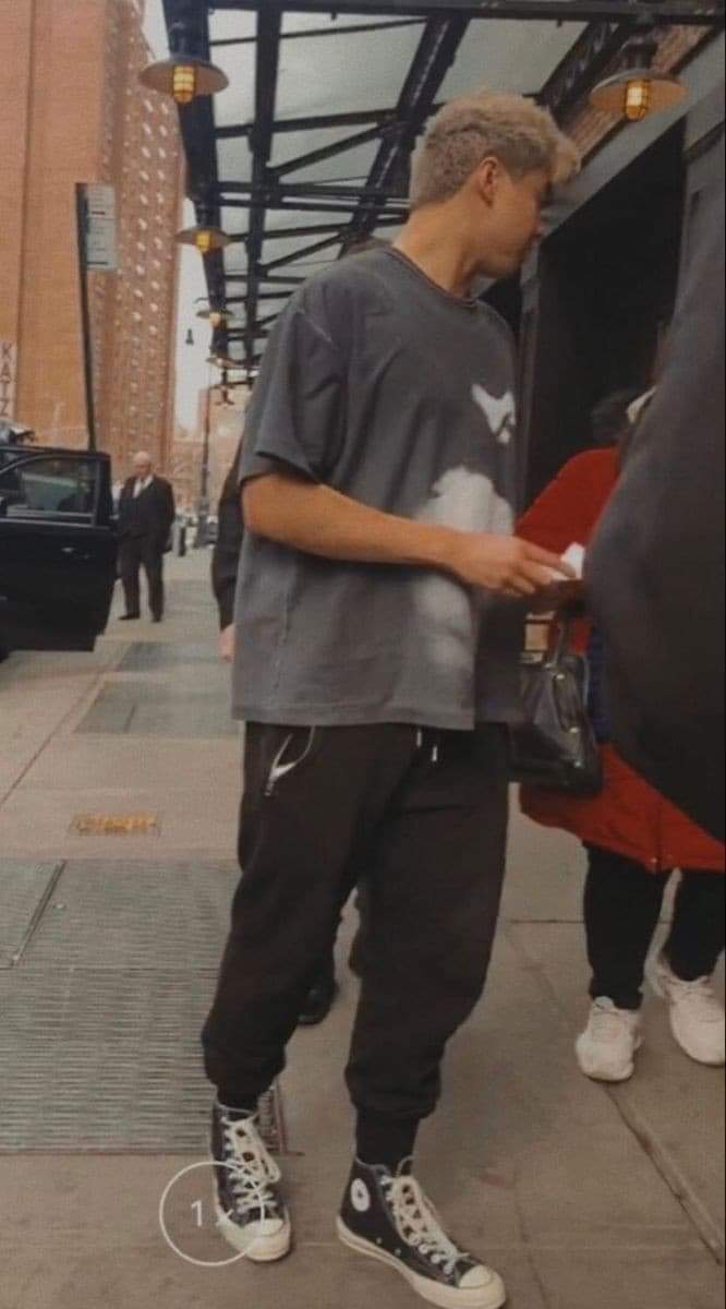 calum hood wearing colourful clothes; a thread