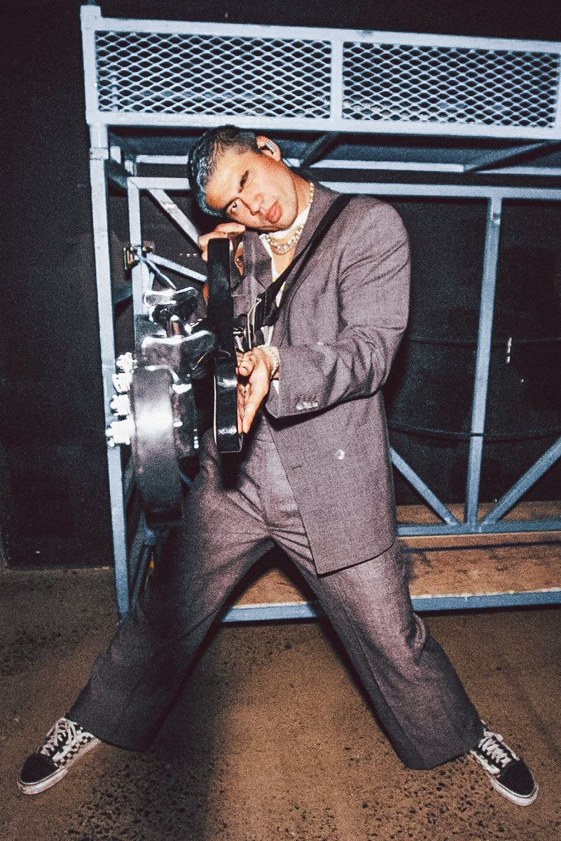 calum hood wearing colourful clothes; a thread