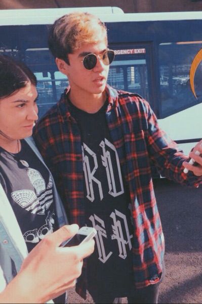 calum hood wearing colourful clothes; a thread