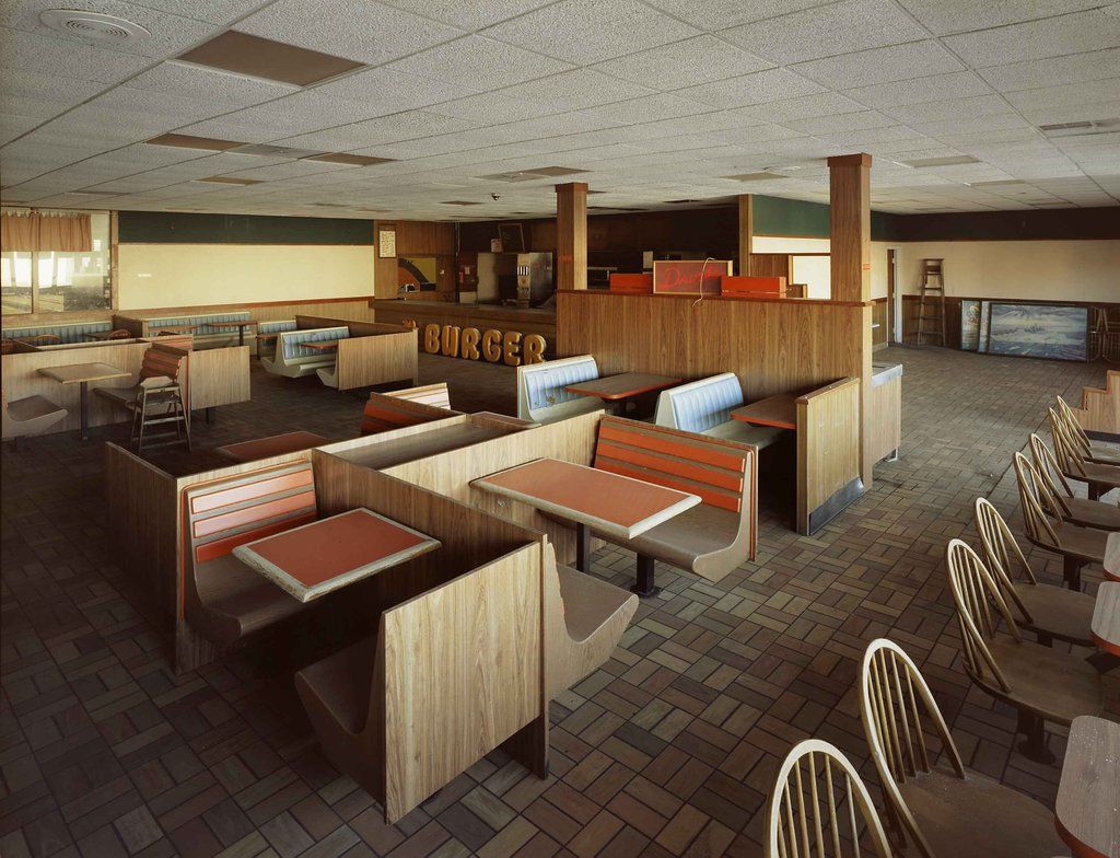 Here's an abandoned Burger King from the 80s. I love the wooden seating and Earth tones, looks much better than current Burger Kings.