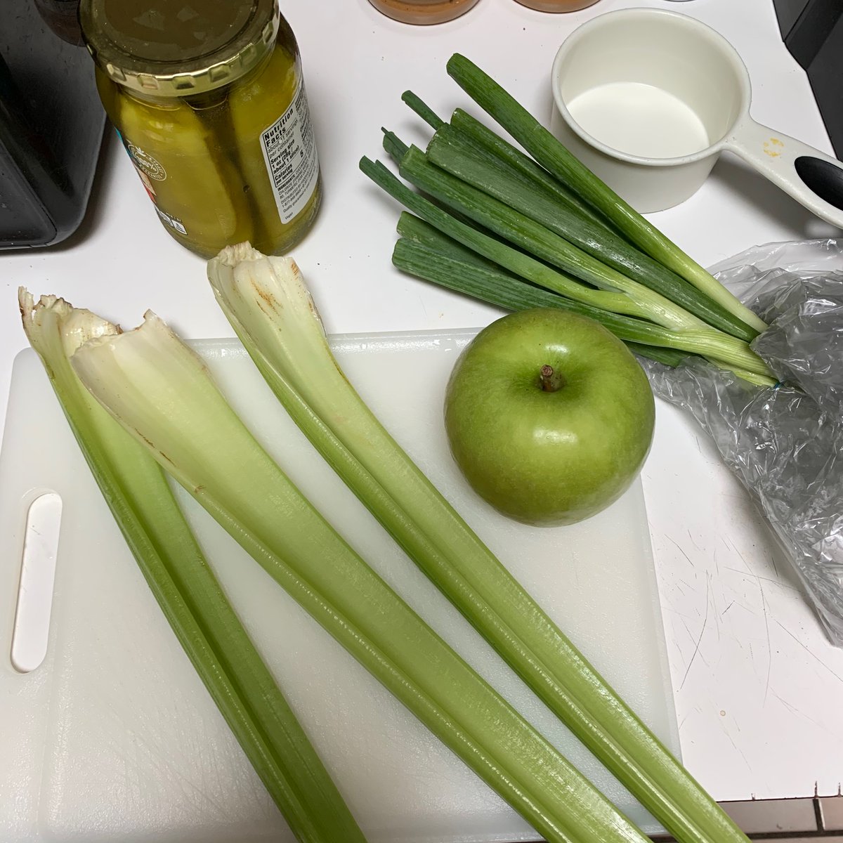 3 stalks of celery, one granny smith, a cup of diced pickles, and the surprise for my wife - scallions. I'm going to make two batches this year. She always tells me my potato salad is missing onions, so this year hers won't be. They will be added last though. 26/