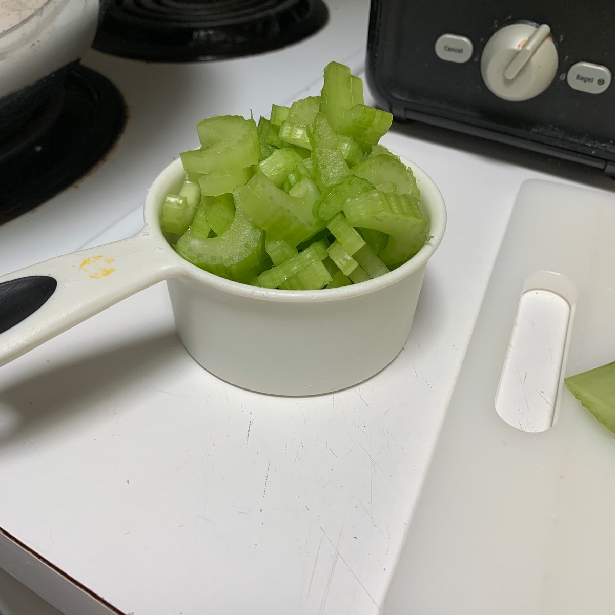 A "cup" of chopped celery. Halfway through I remembered that I forgot to remove the strings from the back of the celery. My wife taught me to do that with celery. She was shown it from the mother of a friend of hers. Her friend passed away over a decade ago. 27/