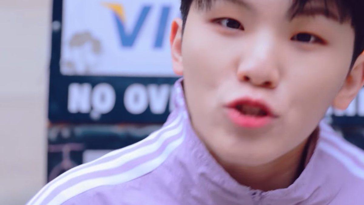  purple seungkwan's tessellated outer suits his landscape (both has lots of elements in it, but still the same dark,cold tone). jihoon's lilac plain lilac training also matches the off-white background. what's witty is that they used black to create contrast in-between!