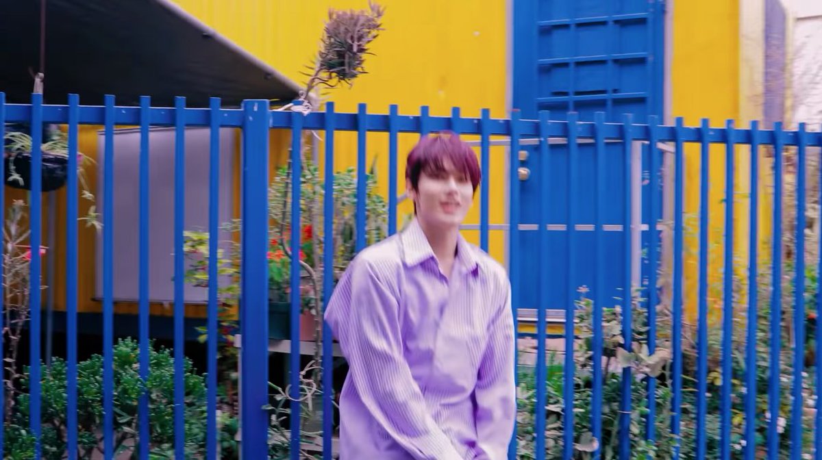  outfit as color accents jun's scene is purple-toned, but there are other colours. he's paired with purplish-grey & blue (toned, still the same tone tho) & has a yellow wall as an accent. though there are 3 main colours, it was well distributed & it creates its own harmony.