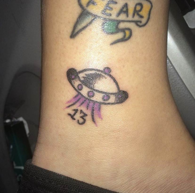 7 & 8. feb 2015 & nov 2015i'll lump these together since they're neighbors!! one is a lyric from car radio by twenty one pilots drawn by a fellow fan. the other is a friday the 13th tat that i colored purple bc cobra starship had just broken up and i was feeling emo about it