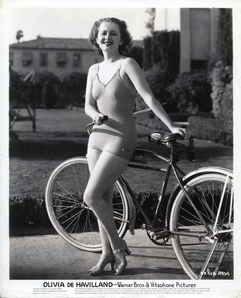 Olivia de Havilland rides a bike at age 103.