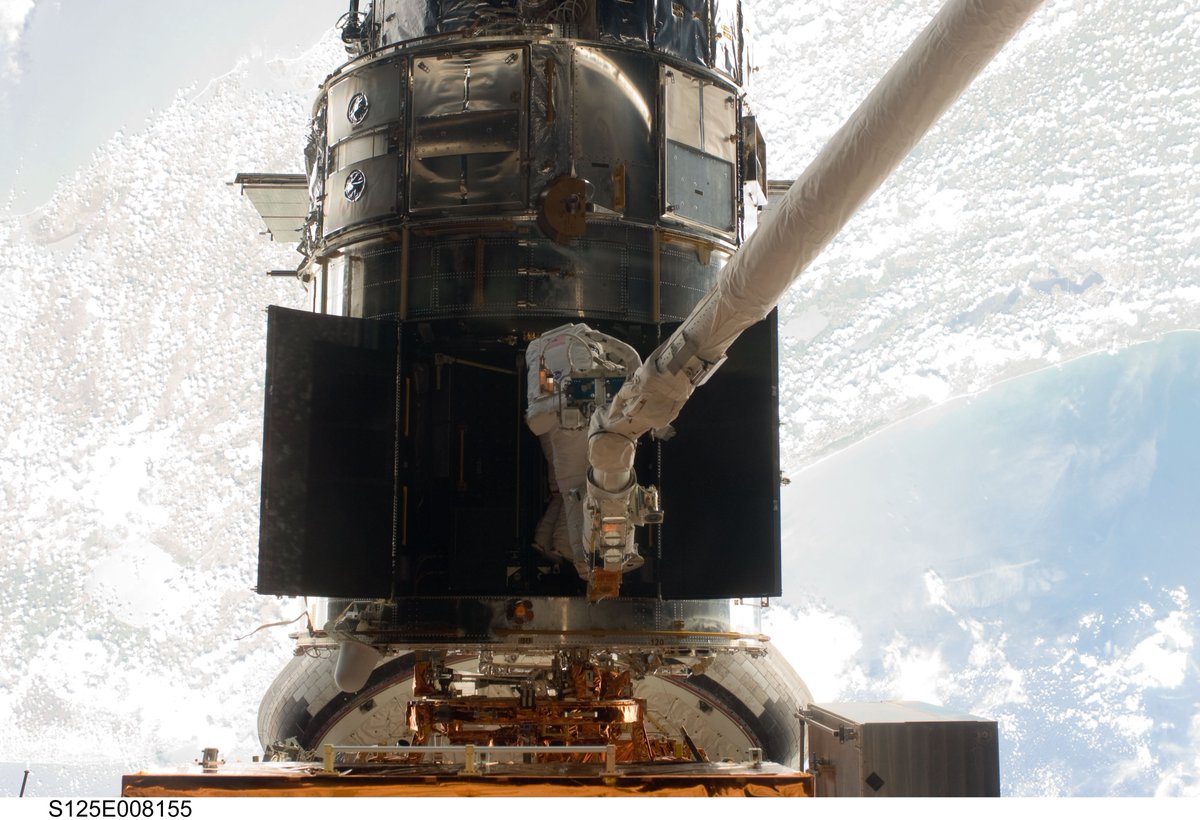 Taken during the servicing of  @NASAHubble on STS-125. You can't see the Space Coast directly in this image, but if you follow the coastline you can see that it is right behind Hubble 