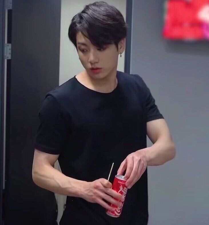 Find u a man that looks hot while opening a can of coca cola