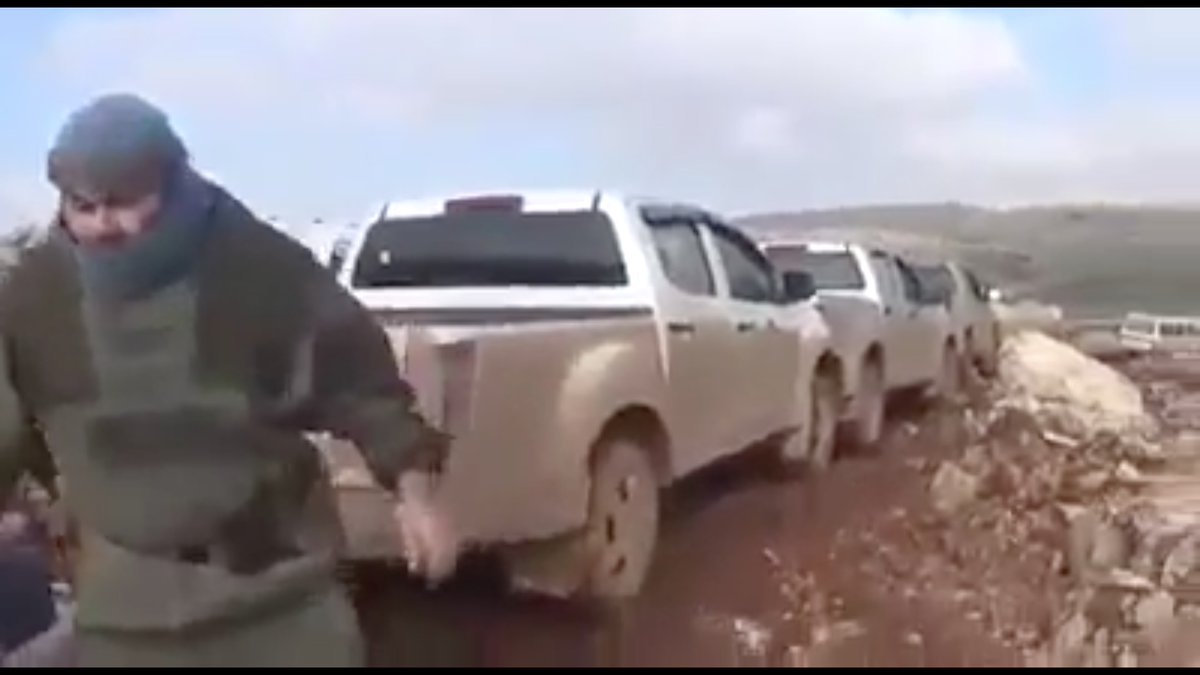 Zenki's desperate flight to Afrin was stopped by air power.Of course there are no known terrorist groups with air power.This man hurriedly ducked away from the camera as the totally intact convoy was being filmed.I have no idea what he's wearing.