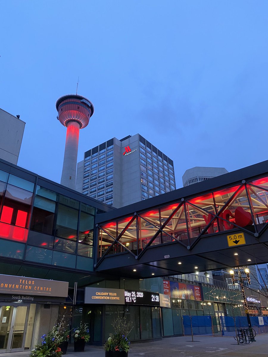 CTCC_Calgary's tweet photo. Tonight, we’re proud to illuminate our Centre in red alongside our partners to celebrate our industry, Calgary’s ultimate hosts and #TourismWeek. @TourismCalgary #LoveYYC https://t.co/VENY4Cd9sg