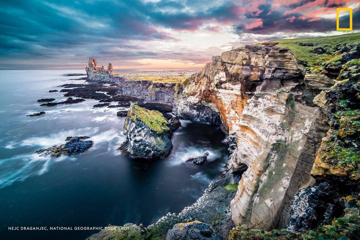 NatGeo's tweet photo. "It took 5 hours to catch this shot, but I think it was well worth it," writes Your Shot photographer Nejc Draganjec of this dramatic image of Iceland's Lóndrangar cliffs https://t.co/0fRv8OmpwU