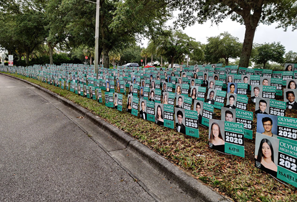Olympia_OCPS's tweet photo. Look at what we installed this morning!  750 senior signs with photos and names.  Later today we will send out information about the Senior Drive-Thru which is this Thursday from 6-8, weather permitting.  You are all invited! @OCPSnews @hsdocps 
https://t.co/wfVCmxi3sG https://t.co/0a5ewzXMsf