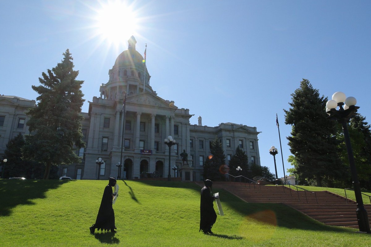 Down at the Capitol where Denver Socialists are dressed up as Death, "thanking" lawmakers for not cancelling rent and, they say, making their "jobs" - as grim reapers - easier.