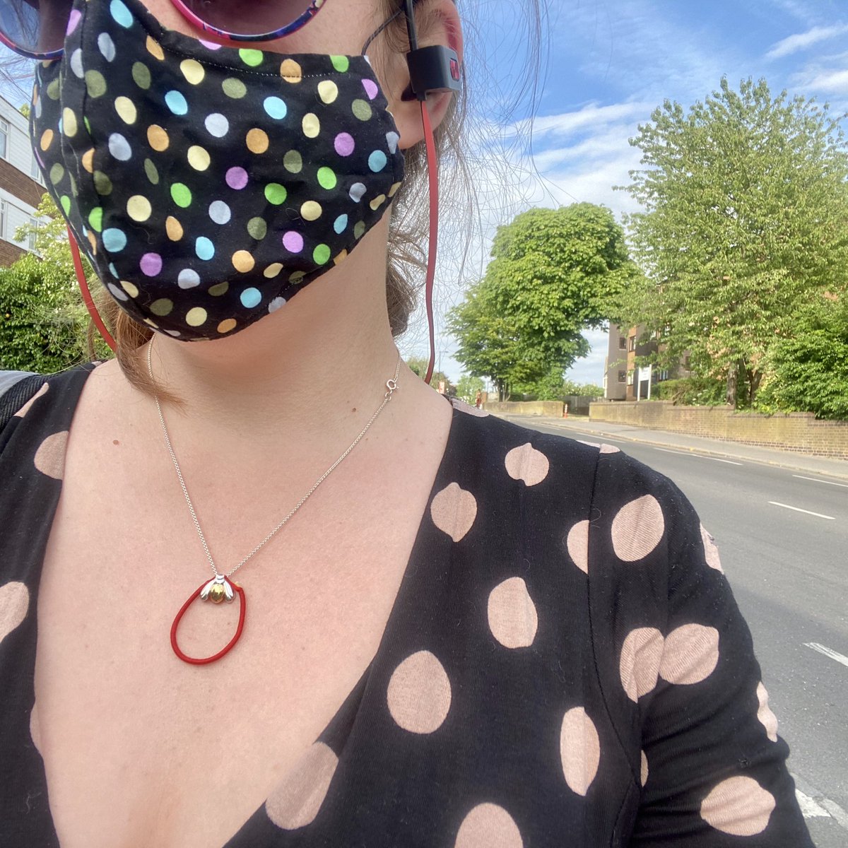 Catching sight of myself in a shop window and realising that I am accidentally wearing a spotty mask and dress. Could have been an intentional style choice; actually a coincidence!