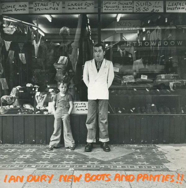 The Art of Album Covers .Ian and Baxter Dury outside Axfords underwear and lingerie shop at 306 Vauxhall Bridge Road, close to Victoria Station. Photo Chris Gabrin 1977. .Used by Ian on New Boots and Panties, released 1977.