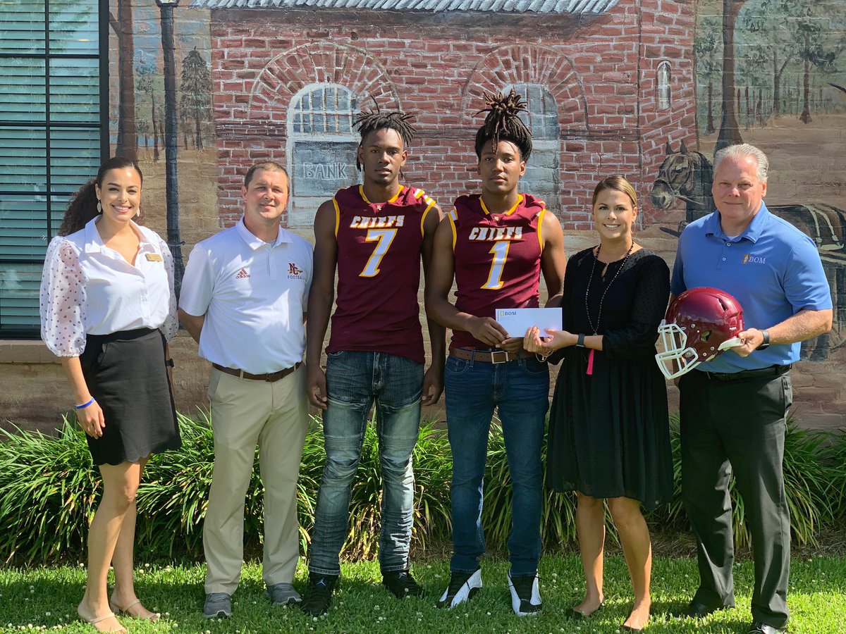 BOMest1903's tweet photo. BOM is proud to be a Corporate Sponsor of the 2020-2021 NCHS Quarterback Club. In the photo from left to right: Blaise LaCour, Head Coach James Wilkerson and defensive ends, Ferman Walker and Jaiden Hare, Carrie Hough, and Tyler Murchison. #bomgivesback https://t.co/vYbVXUn7zU