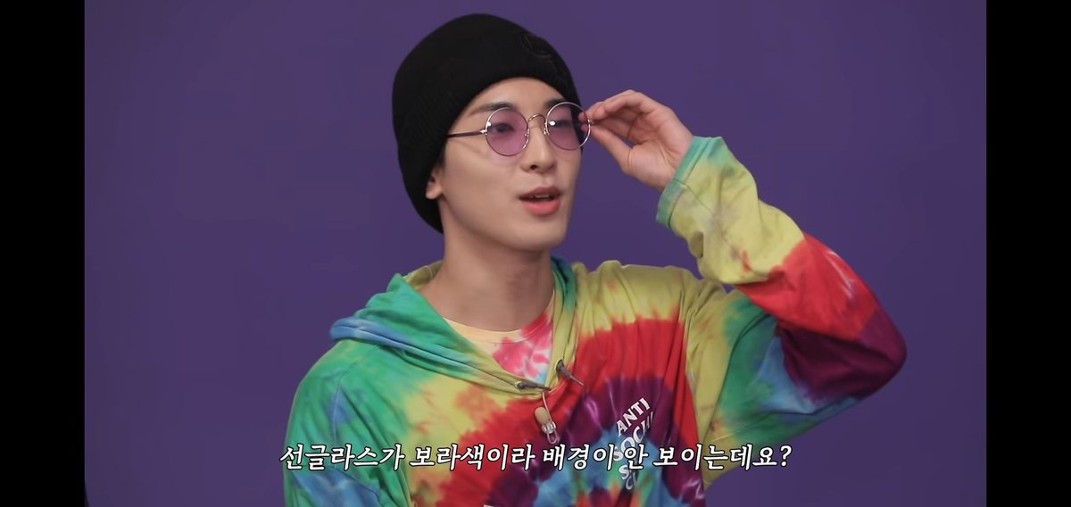 Wonwoo imitated that one instance when Vernon claimed that he can't see anything written in red marker because of his red-tinted glasses. Wonwoo said that he couldn't see the purple background because of his purple-tinted glasses.Reference: Going Seventeen 2019 Ep. 4 @pledis_17