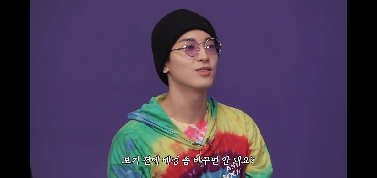 Wonwoo imitated that one instance when Vernon claimed that he can't see anything written in red marker because of his red-tinted glasses. Wonwoo said that he couldn't see the purple background because of his purple-tinted glasses.Reference: Going Seventeen 2019 Ep. 4 @pledis_17