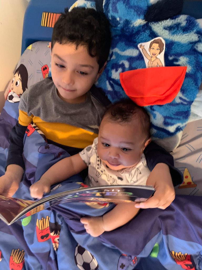 Check out Giovanni and his little brother reading a book to mini Mrs.T! 😍😍 #sharevcs #VANCECoProud #eotigerchamps <a href="/eotigers/">EO Young Elementary</a>