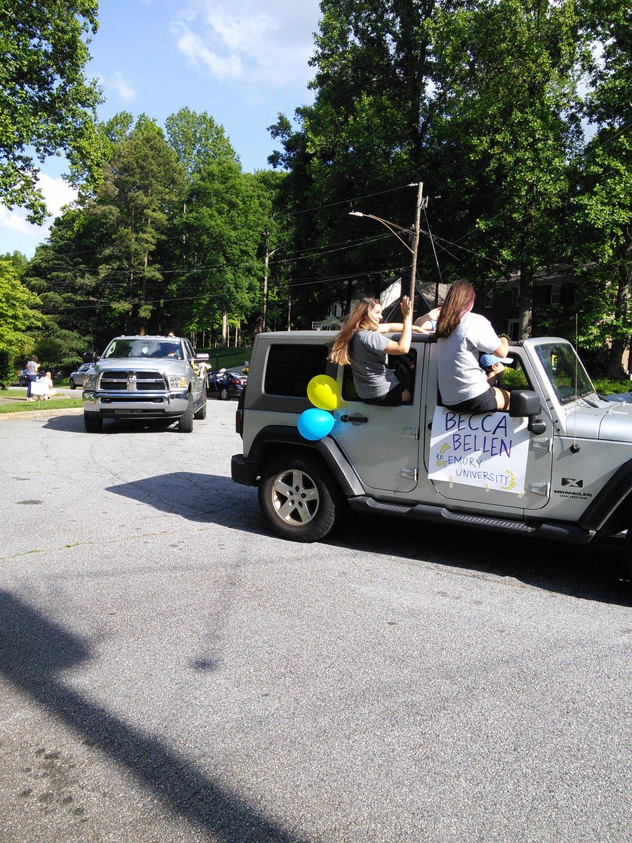 This is how you celebrate the local highschool grads at a distance in a car parade. Dunwoody Ga. 2020.