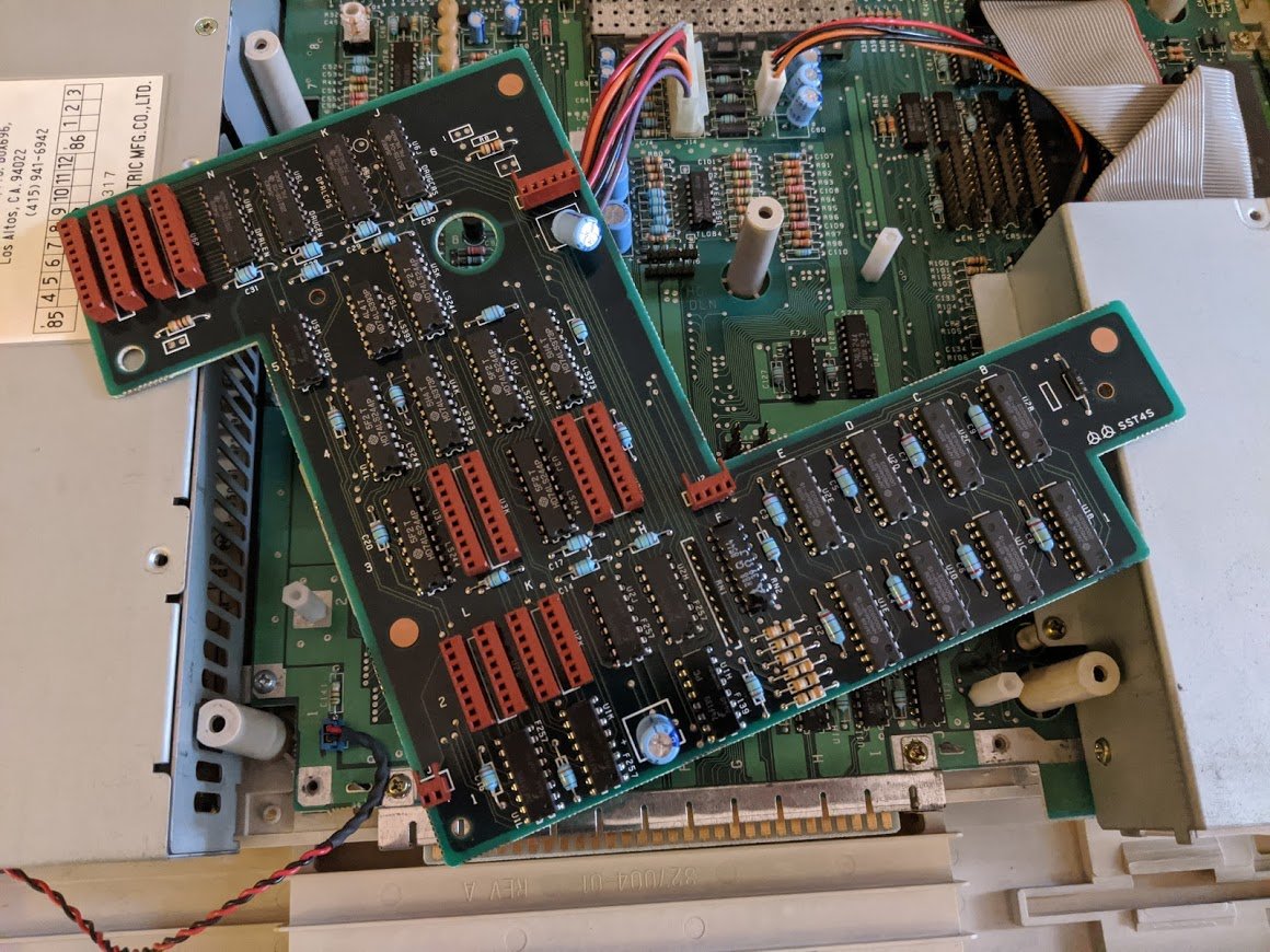 here is the secret RAM! 4 chips (again totaling 256K) on the daughterboard that we just removed! but what IS this mysterious daughterboard anyway?