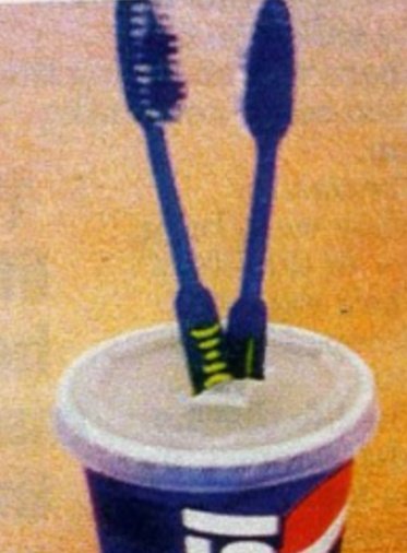 "Life hack!

If you don't have a toothbrush holder, don't sweat it! Just buy a soft drink or soda from a fast food place and stick your toothbrush through the little plus shaped ring!"