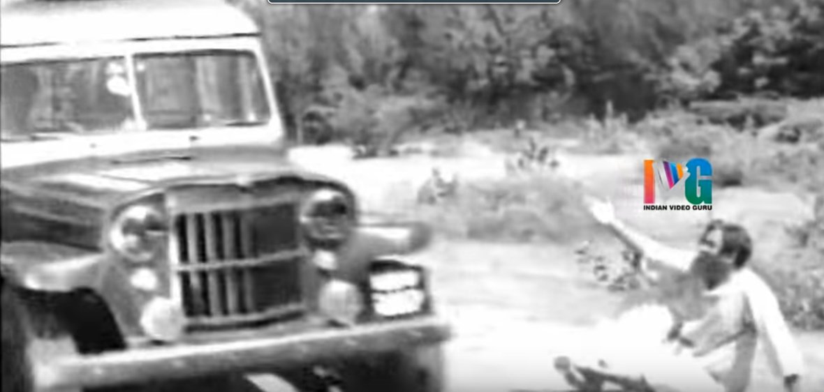 A crippled SV Ranga Rao abandoned in the forest tries to hail a 1950 Willy's Jeep Utility Station Wagon unsuccessfully.Gali Medalu (1962)