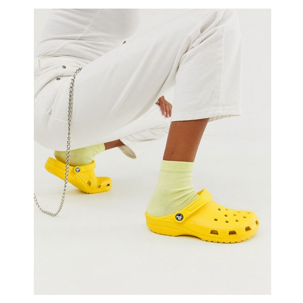 yellow crocs on feet