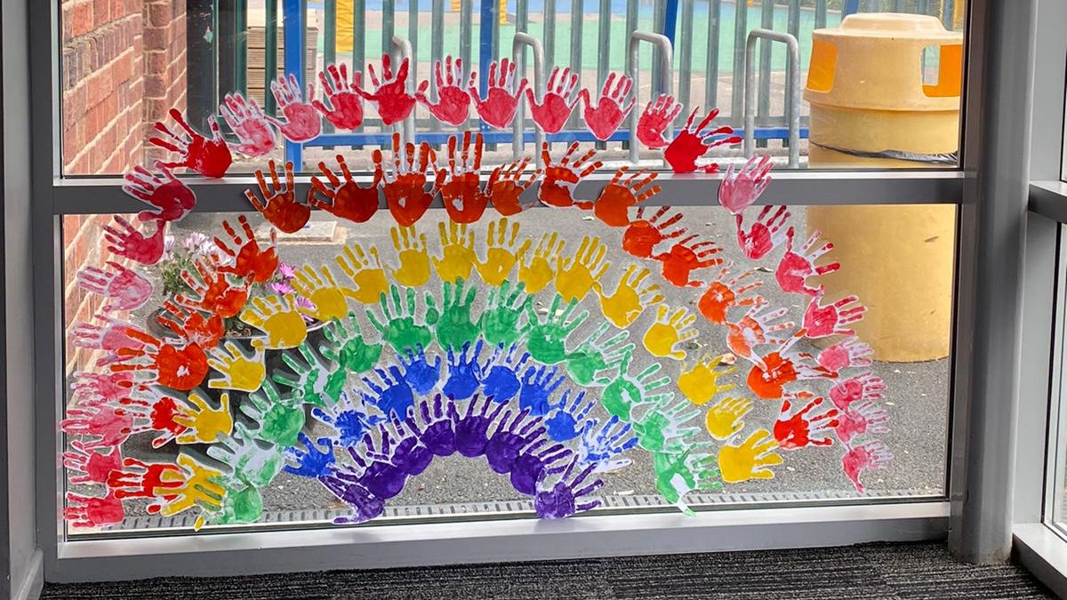 A rainbow made out of hands, created by our 'Key Worker' children!