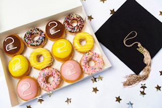 On Tuesday, May 19, <a href="/krispykreme/">Krispy Kreme</a> will give its new “Graduate Dozen” FREE to any high school or college senior – no purchase necessary – who visits a Krispy Kreme dressed in their graduation cap and gown or “Class of 2020” shirt, letterman jacket or other swag.