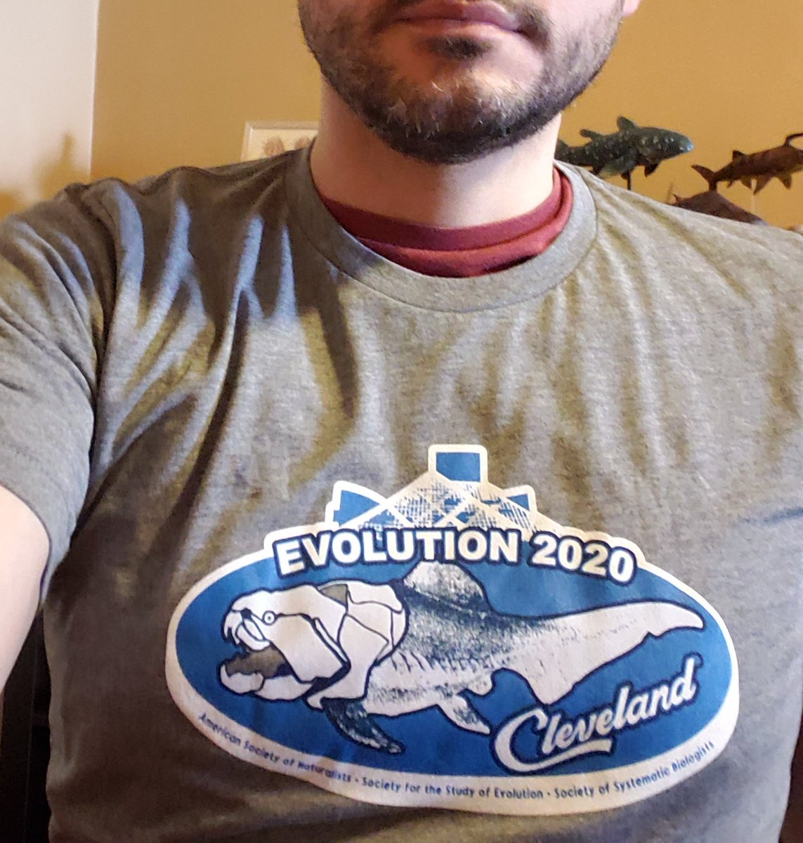 TimDrawsFish's tweet photo. #Evolution2020 isn't happening this year but at least I got this sweet shirt. Not the most accurate #Dunkleosteus (inspired by Schleich toy?), but still a winner. #FossilFriday https://t.co/eA9ojyjC6u