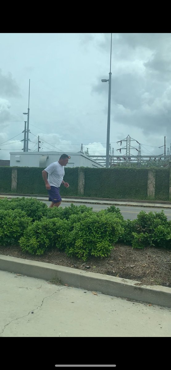 KevinGeorge1911's tweet photo. Right after taking these pics on @LSU’s campus today, we get in the car and my youngest snaps a pic of @Coach_EdOrgeron jogging and says, “It’s Coach O!”😂 #LSUGrad #GeauxTigers #ForeverLSU. Today, I traded in my red & gray for purple & gold. So Proud! @NichollsState https://t.co/xngP7KNZFQ