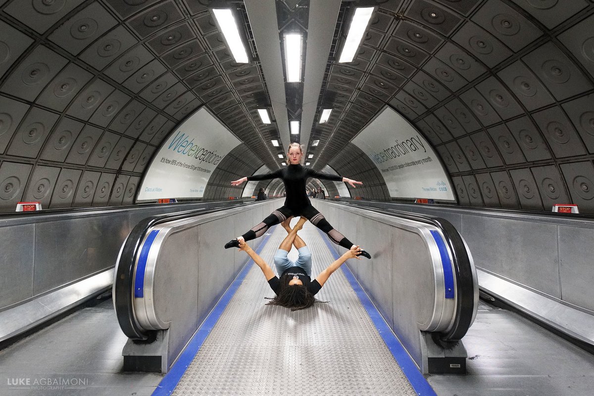 LONDON UNDERGROUND SYMMETRY PHOTO / 43WATERLOOAcrobatic Yoga Dancers Romana & Eugene, hold a pose at Waterloo station.  http://instagram.com/tubemapper   http://shop.tubemapper.com/Waterloo/ Photography thread of my symmetrical encounters on the London Underground #yoga  #danceTHREAD