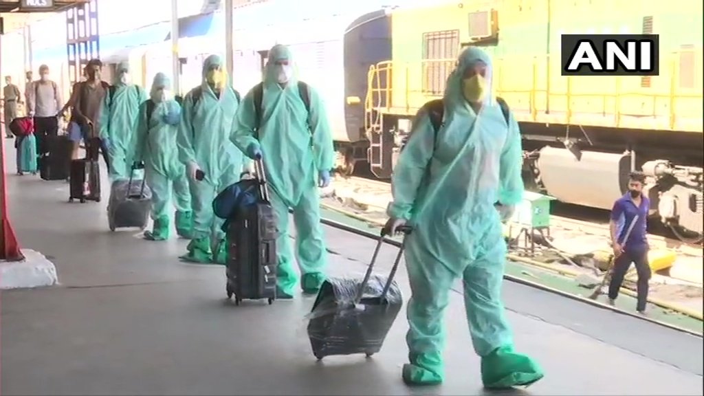 timesofindia's tweet photo. A special train,carrying passengers from Mumbai arrived at New Delhi railway station today. All passengers were screened after they reached the railway station, as per guidelines by the government. (Pics: ANI) https://t.co/XeMB0mNI8K