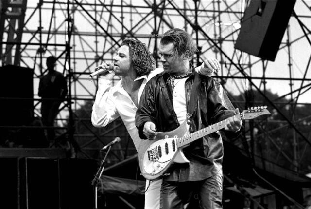 Hutch_Legend's tweet photo. #MichaelHutchence & #TimFarriss performing at the #ConcertForLife in Sydney, March 28th 1992. 🇦🇺
Photo from the archives of #BobKing
#INXS #AustralianMusic #Australia #90sMusic #SaturdayVibes #RockStar #RockNRoll #Legend #Musician #90s #LiveMusic #IconicConcerts https://t.co/Rdu8P4onBf