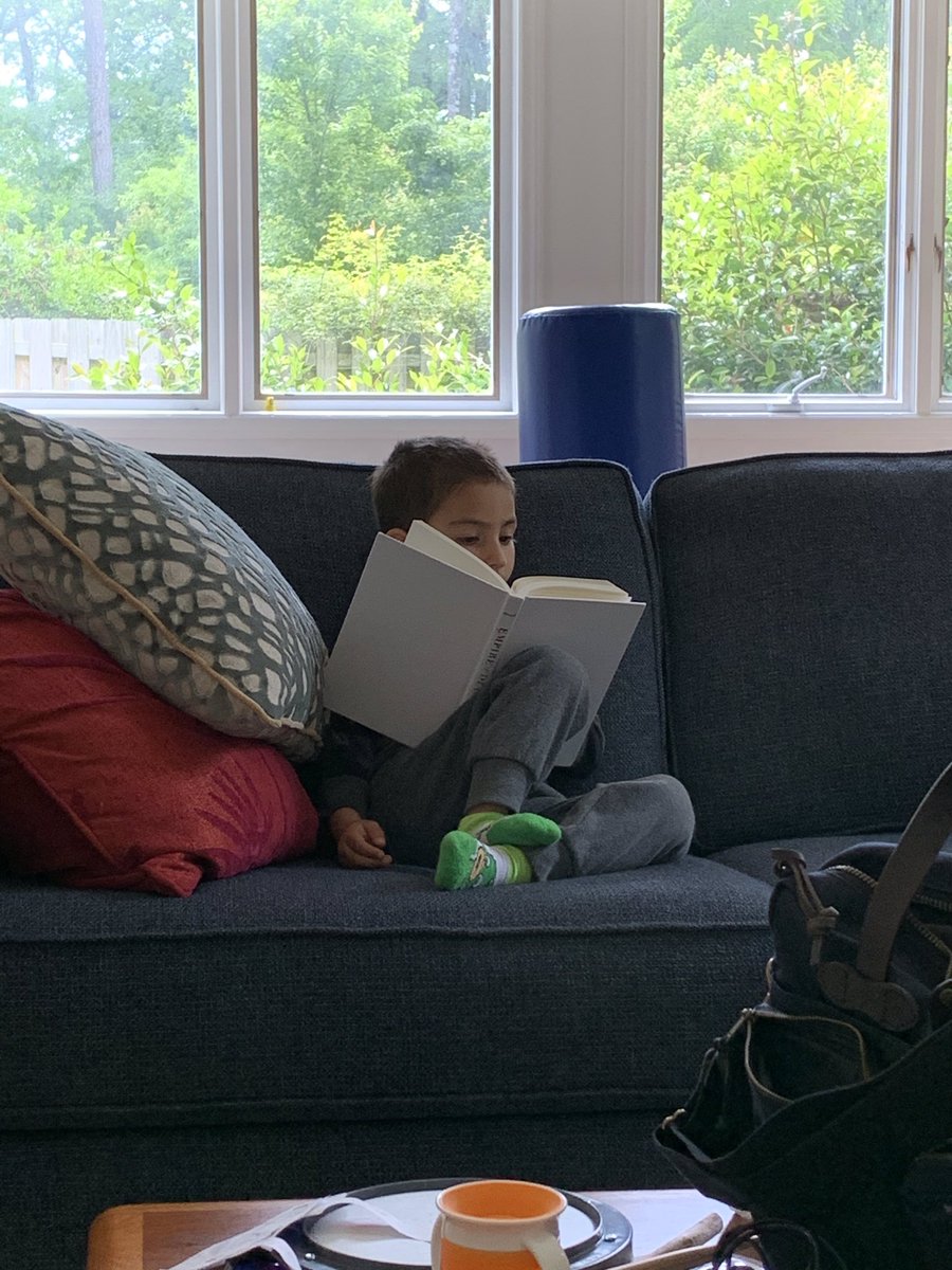 AdrienneMunich's tweet photo. Max reading #EmpireofDiamonds.  “Grown-up books have a lot of words. @uvapress book is dedicated to him https://t.co/o9N3jF95J6