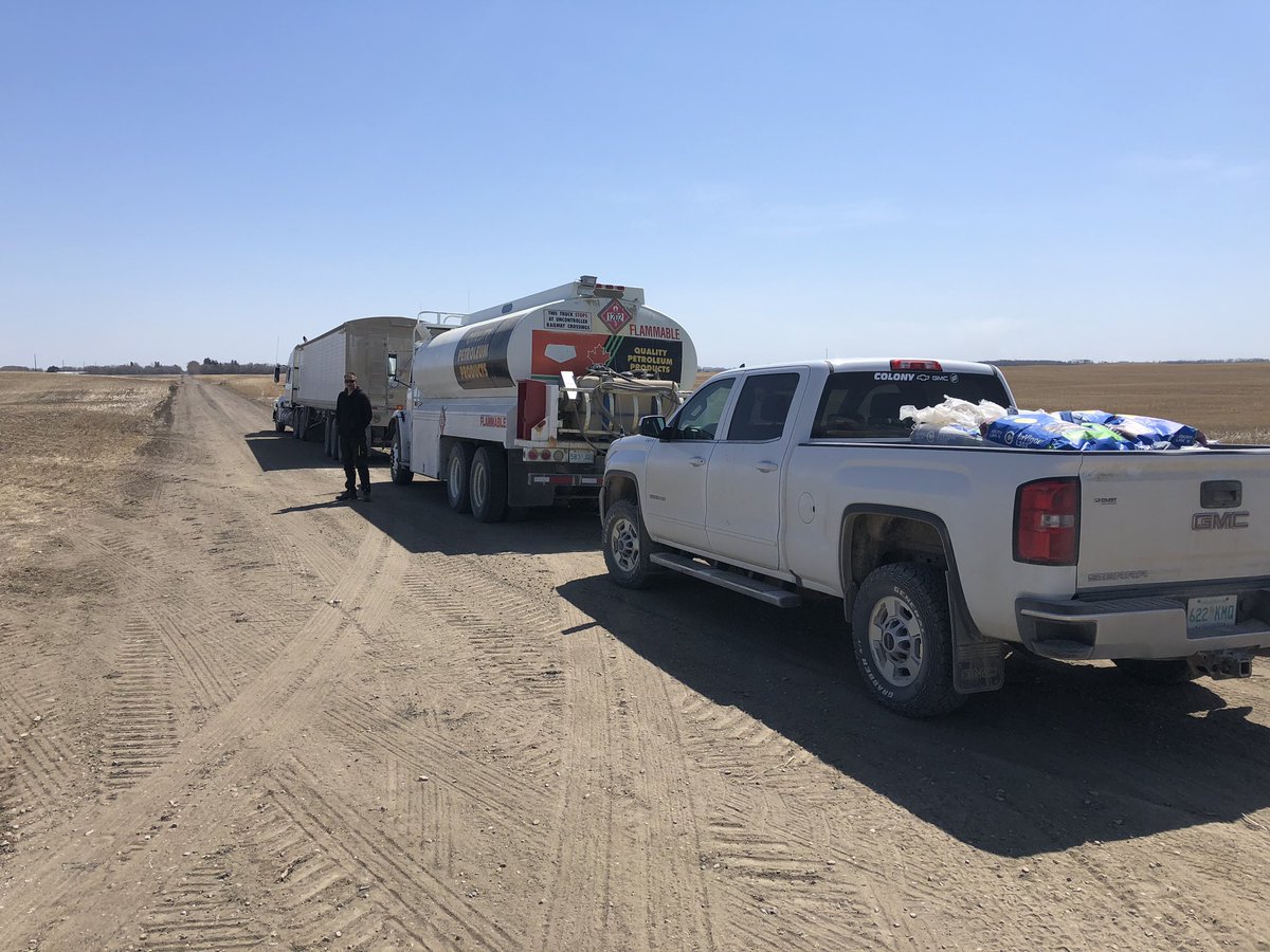 Christo and Soenke on a “farmer” pit crew getting ready for Greg Puetz to come with drill - fill with canola seed, diesel and DEF, and fertilizer.