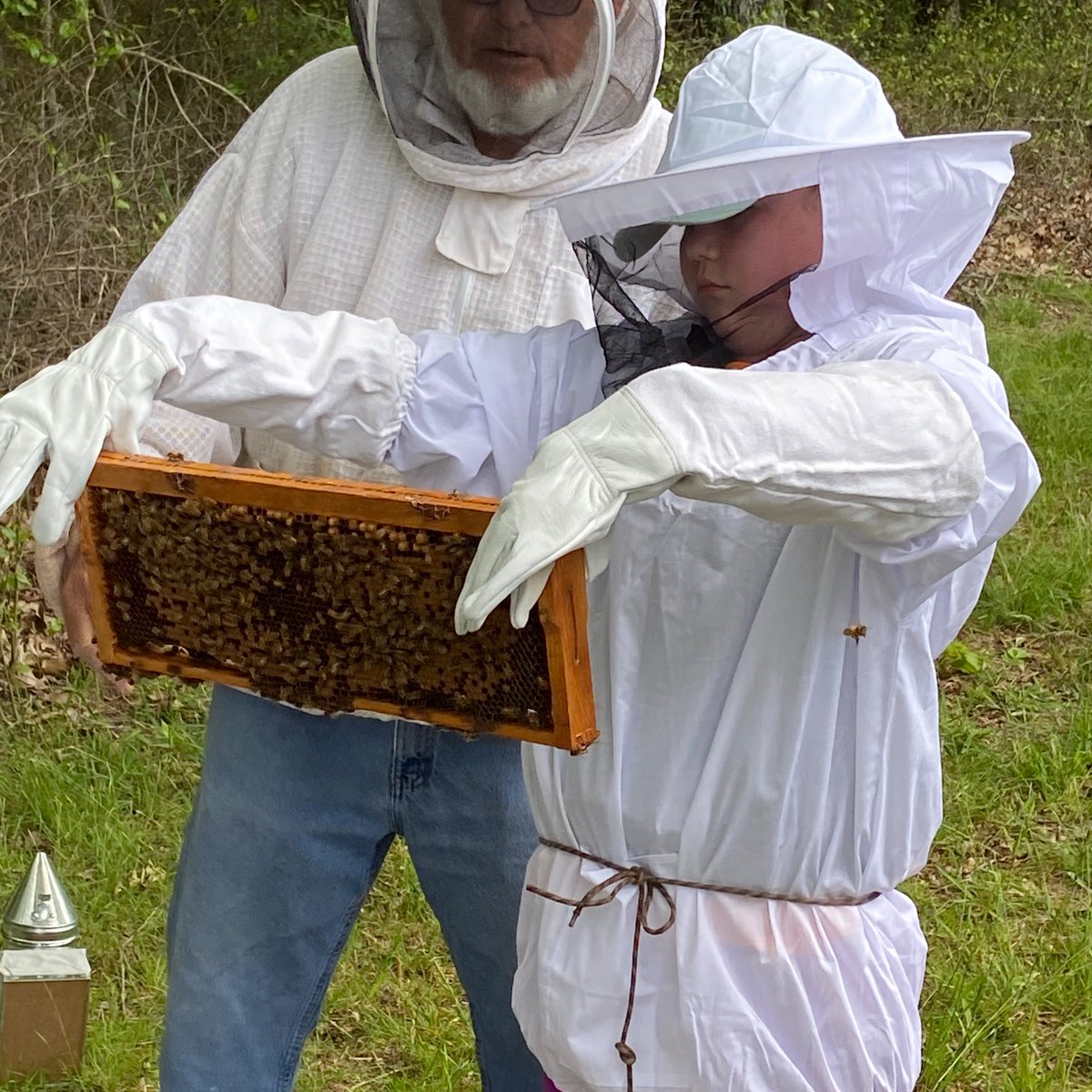 mallorybirdwell's tweet photo. This is my sweet Lila officially becoming a bee keeper today! She became very interested in bees after our Read to Ready Summer Camp and jumped at an opportunity through 4-H to get some help starting her hives. We hope to have “Boo’s Bees” selling honey by next year. https://t.co/bQoB5JszKD