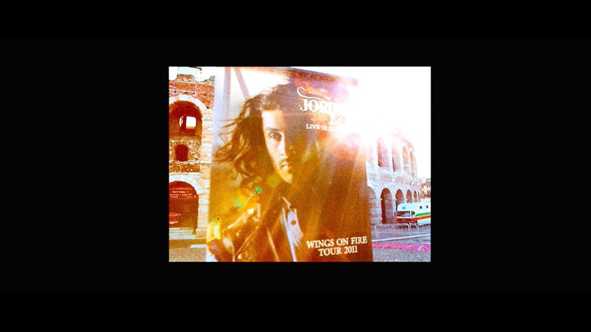 The story beings somewhere in Europe where Jordan, the protagonist is already a cult-music-icon. People are thronging in lines, buying his shirts, yelling, and shouting his name. There's an enigma around is all we know from these shots. They are shot in 5D, some by RK himself.