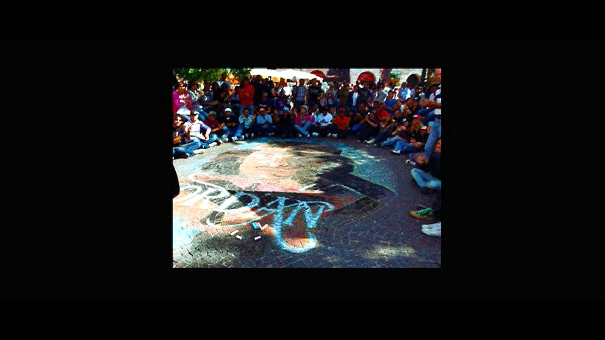 The story beings somewhere in Europe where Jordan, the protagonist is already a cult-music-icon. People are thronging in lines, buying his shirts, yelling, and shouting his name. There's an enigma around is all we know from these shots. They are shot in 5D, some by RK himself.