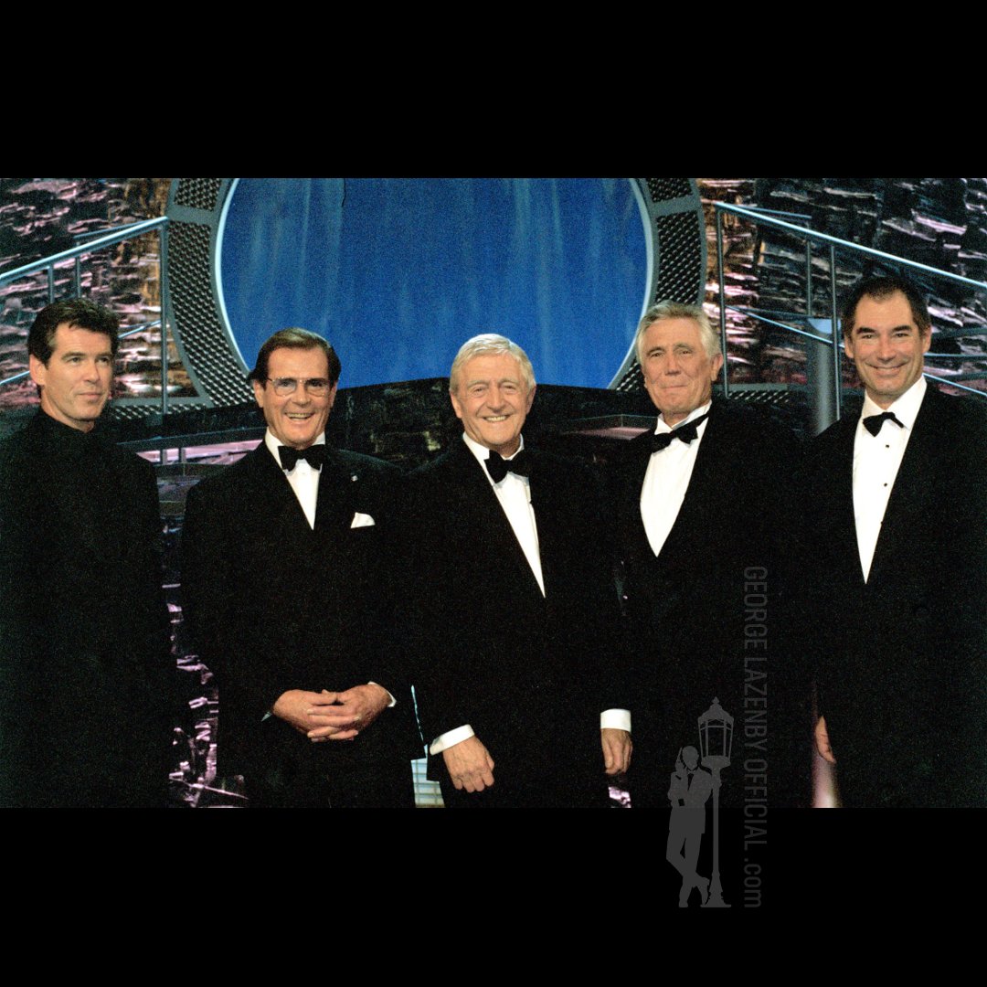lazenbyofficial's tweet photo. Belated birthday wishes to @PierceBrosnan for 16th May. Well, as we're members of the same club... Here we are with Roger, Tim &amp; Michael Parkinson back in 2002. Sean couldn't join us as I recall he was filming in the Czech Republic. Let's raise a glass for the Irishman. George xx https://t.co/kOpWDPlCxE