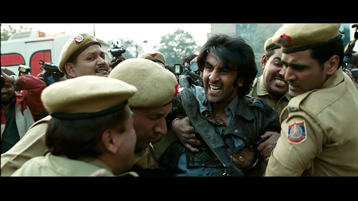 Jordan has gone wild, or he doesn't know what's happening in him or what's his objective. He is indifferent towards emotions. He burns his guitar, watches it, and shows the Jim Morrison iconic middle-finger. He becomes everything, but nothing also.