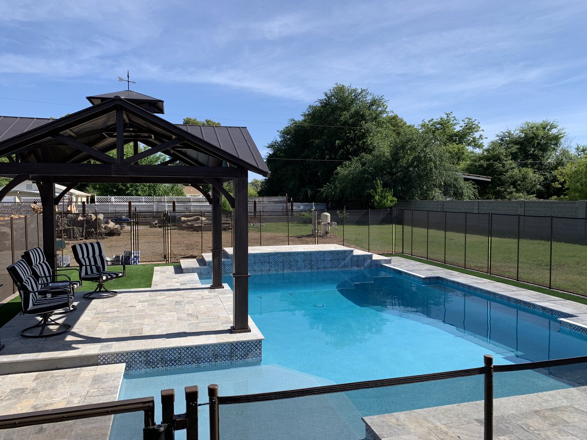 trmoser's tweet photo. The gazebo is done and the shade will be more than welcome!
•
I only had to put the ladder in the pool once to get to a spot I couldn’t reach.
#notwood #metal #gazebo #pool #travertine #meshfence #swimming #summertime https://t.co/NaKej0vtJR