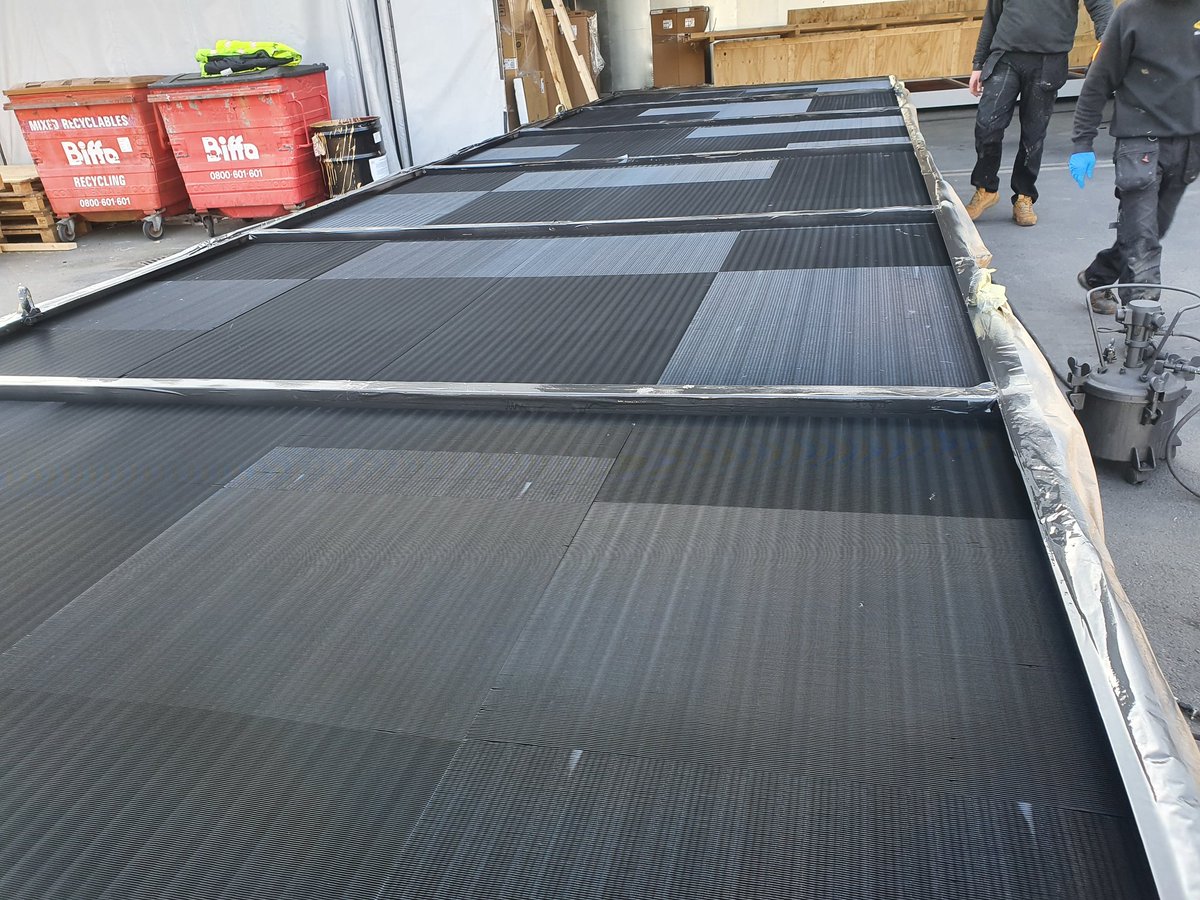 Bronz-Glow UK engineers finishing off a 8+ meter coil in the sun.