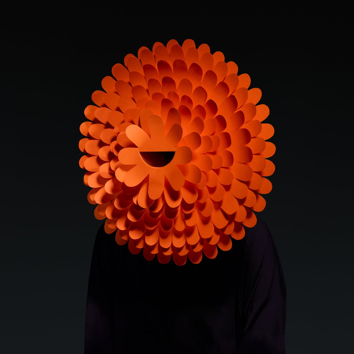 londonbiennale's tweet photo. For #LDB18 ‘Emotional States’ theme, Pentagram developed a creative campaign of masks inspired by Charles Darwin’s discovery of universal emotions. JOY: inspired by the simple flower, a central smile is surrounded by a layered petal feature to capture the emotion #LDB20 #Design https://t.co/xkzf4jimw7