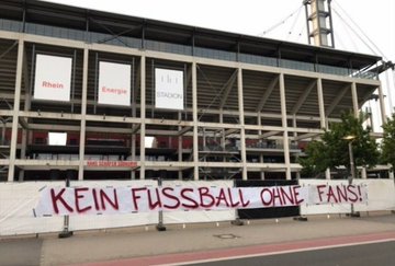 FC Koln protest against the restart of football in Germany Posters read 'Our money is more important than your health - Bundesliga at any cost' Banner reads 'No football without fans!” #effzeh