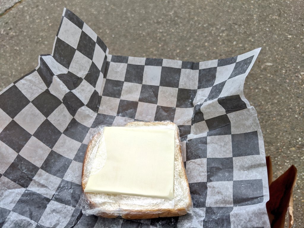 This bar is handing out "deconstructed grilled cheese sandwiches" as its compliance food.  – at  Logan Circle Park